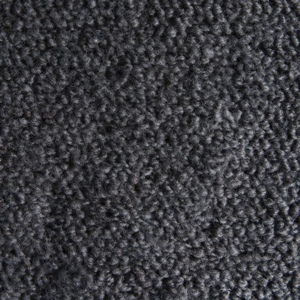 Close-up of charcoal-gray wool bouclé fabric with a looped texture.